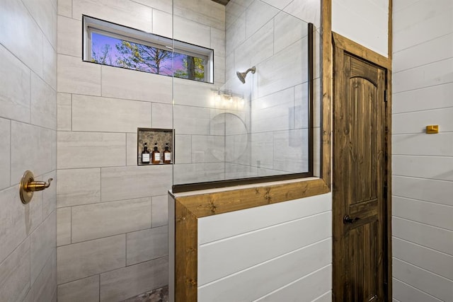 bathroom with tiled shower