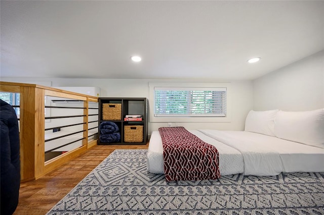 bedroom with hardwood / wood-style floors