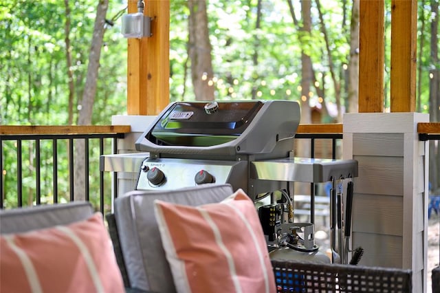 wooden deck featuring a grill