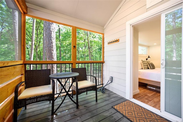 sunroom / solarium with vaulted ceiling