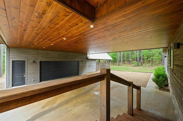 interior space featuring wood walls and wood ceiling