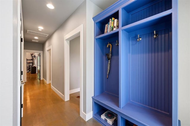 mudroom with dark wood-type flooring