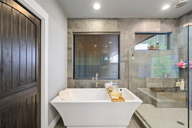 bathroom with shower with separate bathtub