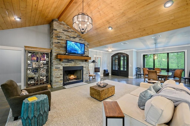 living room featuring wooden ceiling, lofted ceiling with beams, a notable chandelier, a fireplace, and ornamental molding