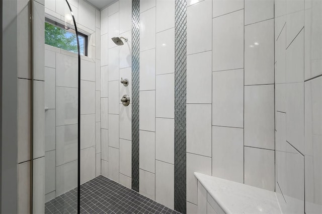 bathroom featuring tiled shower