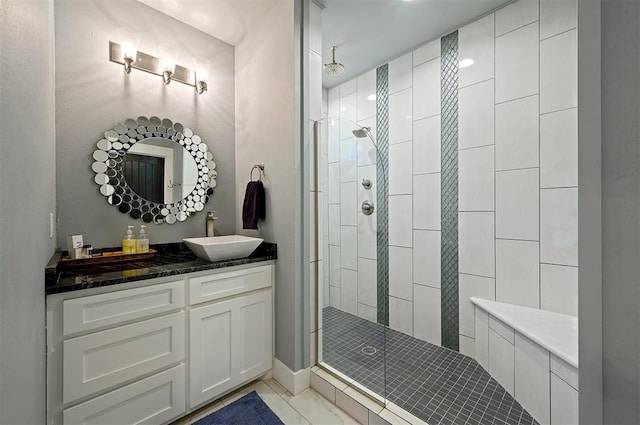 bathroom featuring vanity and a shower with door