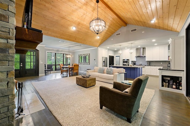 living room with high vaulted ceiling, a notable chandelier, wooden ceiling, beamed ceiling, and light hardwood / wood-style floors