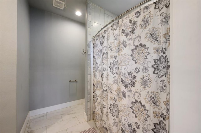 bathroom with a shower with shower curtain