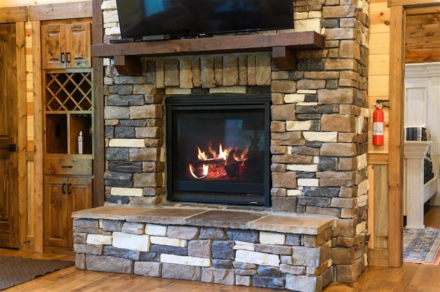 interior details with a fireplace and wood-type flooring