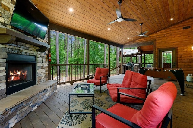 152 Ita Hina Trl, Broken Bow, OK 74728 - sunroom / solarium with an outdoor living space with a fireplace, a ceiling fan, and vaulted ceiling