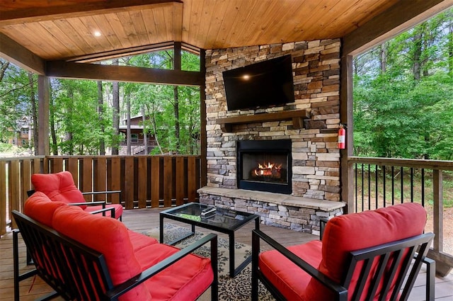 exterior space with an outdoor living space with a fireplace