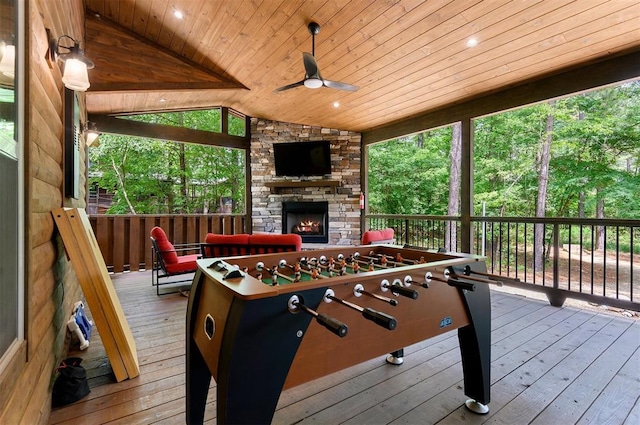152 Ita Hina Trl, Broken Bow, OK 74728 - wooden terrace with a stone fireplace and a ceiling fan