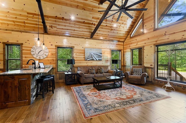 152 Ita Hina Trl, Broken Bow, OK 74728 - living area with wood-type flooring, wooden walls, wooden ceiling with exposed beams, and high vaulted ceiling