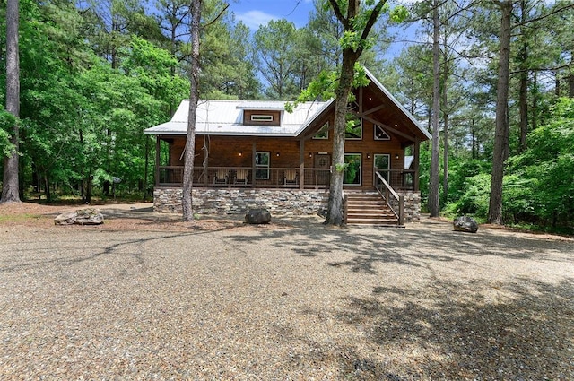 152 Ita Hina Trl, Broken Bow, OK 74728 - rustic home featuring a porch, metal roof, and stairs