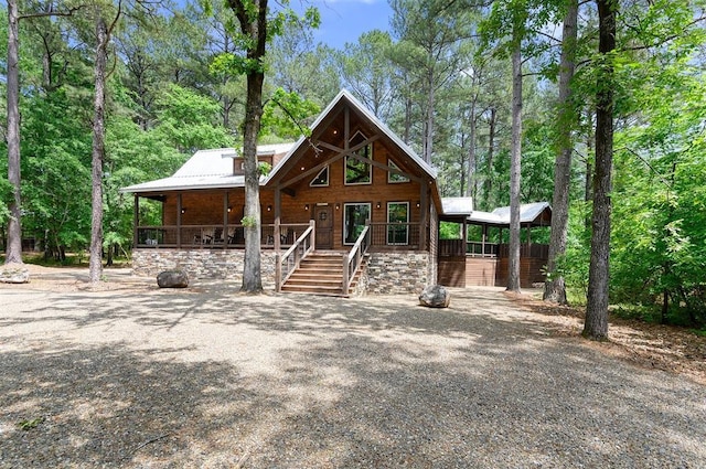 152 Ita Hina Trl, Broken Bow, OK 74728 - chalet / cabin featuring a carport, covered porch, and metal roof