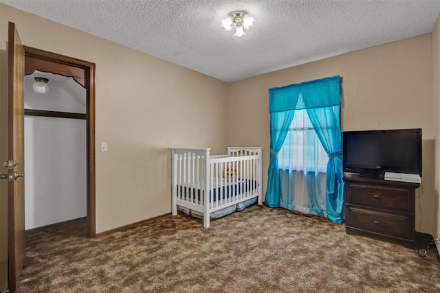 unfurnished bedroom featuring a textured ceiling and carpet floors