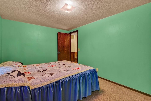 carpeted bedroom featuring a textured ceiling