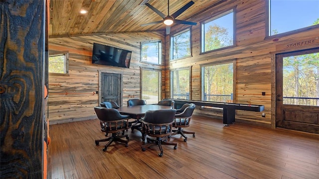 dining area featuring a wealth of natural light, ceiling fan, wooden ceiling, and hardwood / wood-style flooring