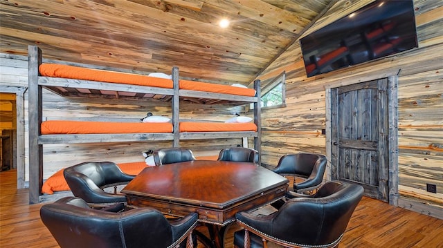 office area with wooden ceiling, hardwood / wood-style flooring, lofted ceiling, and wood walls