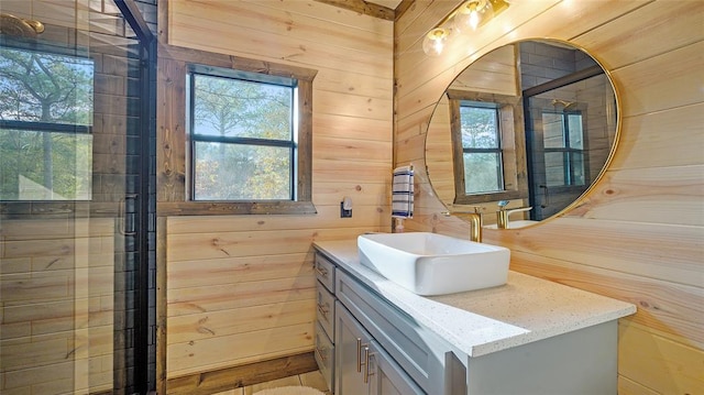 bathroom with wood walls, hardwood / wood-style floors, and vanity