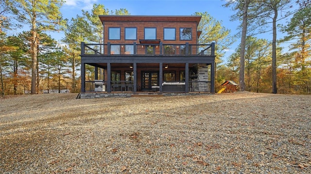 rear view of property with a wooden deck