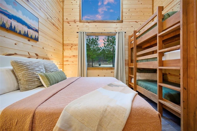 bedroom with wooden walls