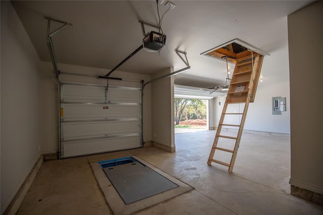 garage featuring electric panel and a garage door opener