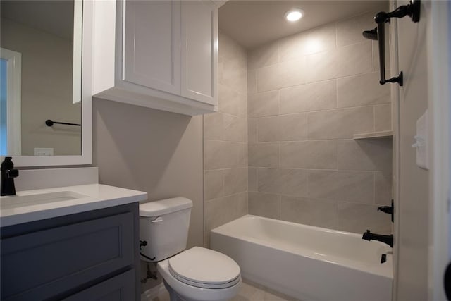 full bathroom with vanity, toilet, and tiled shower / bath combo