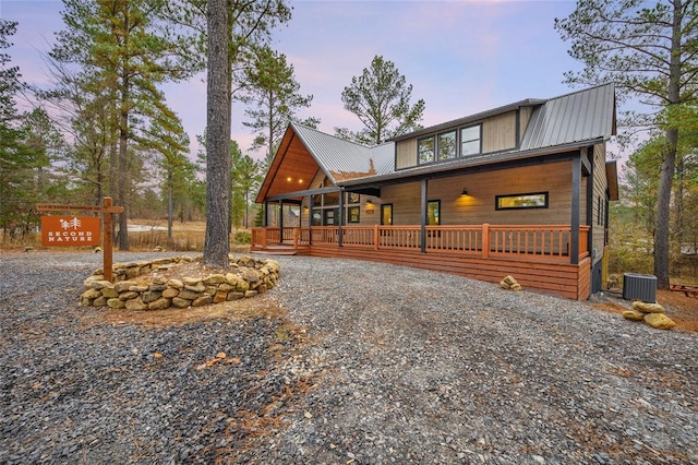 view of front of property with central AC unit and covered porch