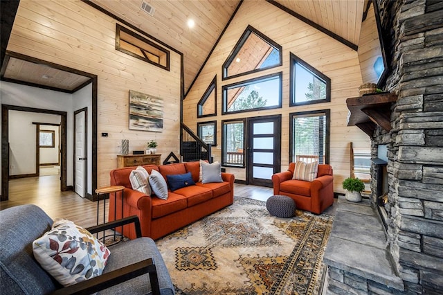 living room featuring wood-type flooring, high vaulted ceiling, and wood ceiling