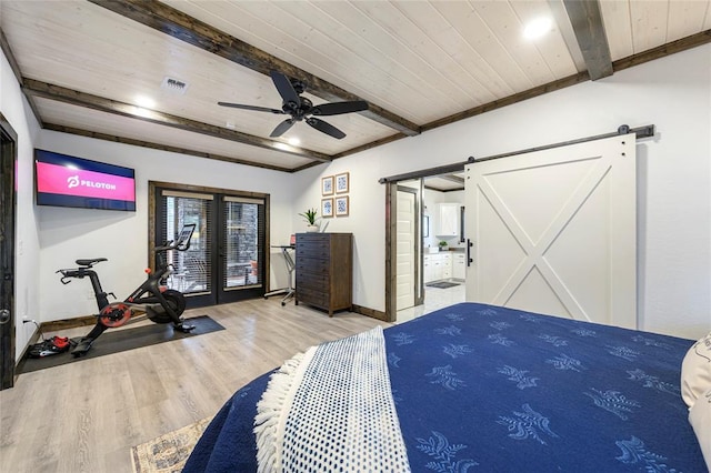 bedroom with beam ceiling, ceiling fan, wooden ceiling, a barn door, and light hardwood / wood-style floors