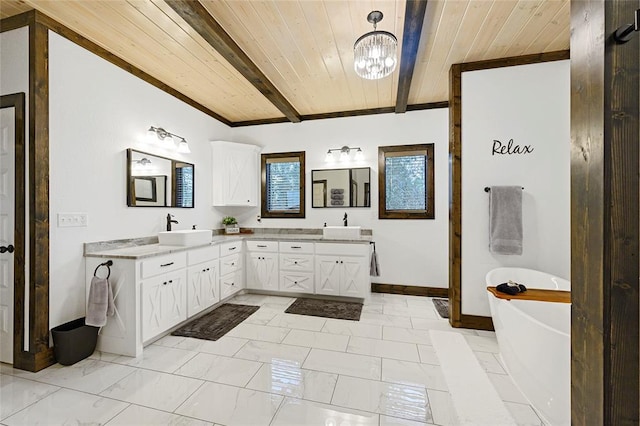 bathroom with beam ceiling, wooden ceiling, an inviting chandelier, a bathtub, and vanity