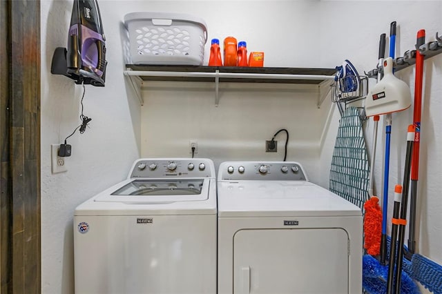 clothes washing area featuring washing machine and dryer