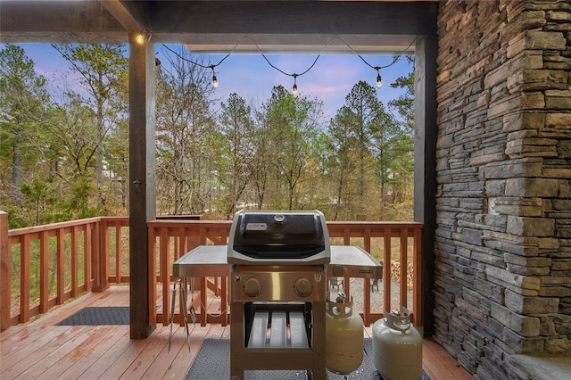 deck at dusk with a grill