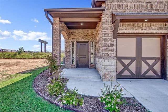 doorway to property featuring a lawn