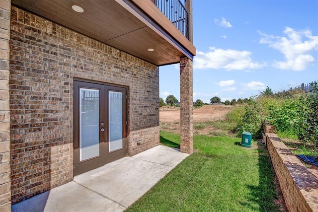 exterior space with french doors, a balcony, and a patio