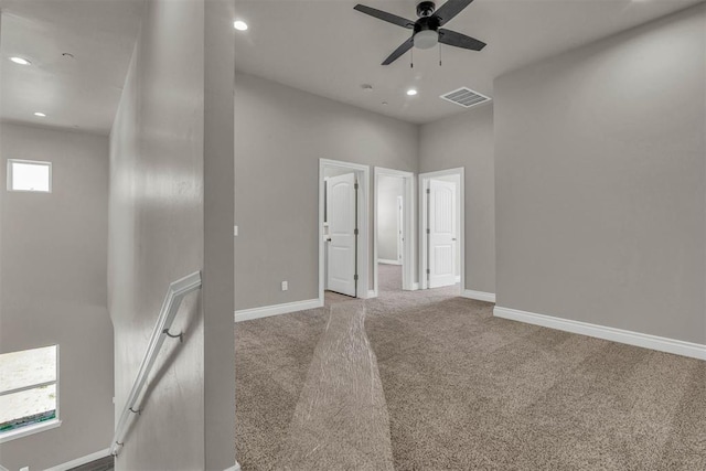 empty room with carpet and ceiling fan