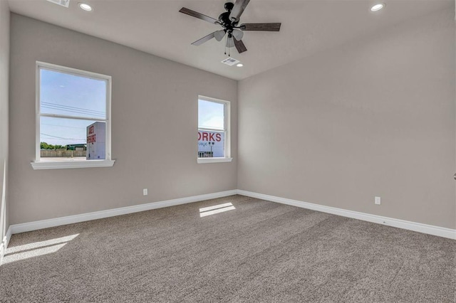 empty room with carpet flooring and ceiling fan