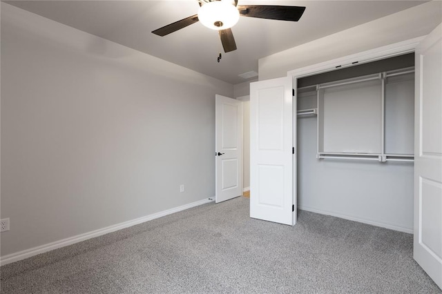 unfurnished bedroom with ceiling fan, a closet, and light carpet