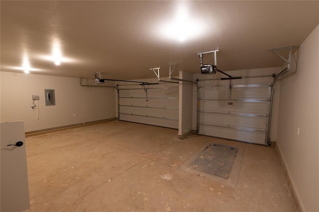 garage featuring a garage door opener and electric panel