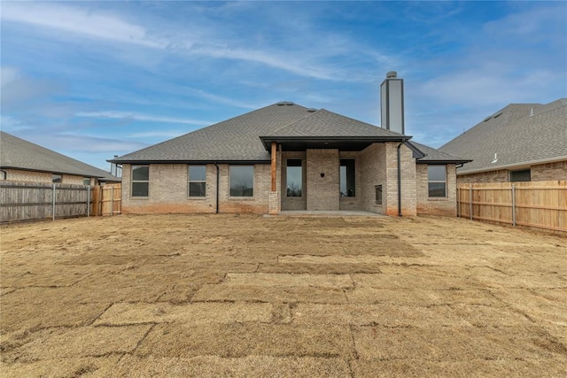 back of property featuring a patio area