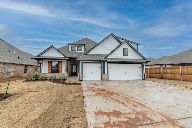 view of front of home with a garage and covered porch