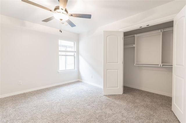 unfurnished bedroom featuring carpet floors, a closet, and ceiling fan