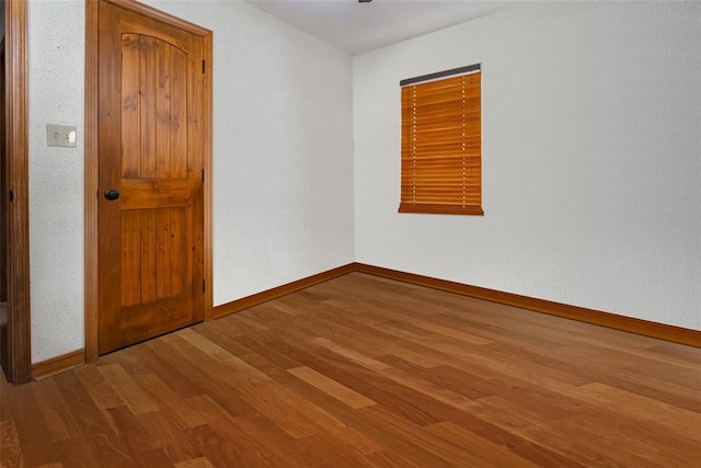 spare room featuring hardwood / wood-style floors