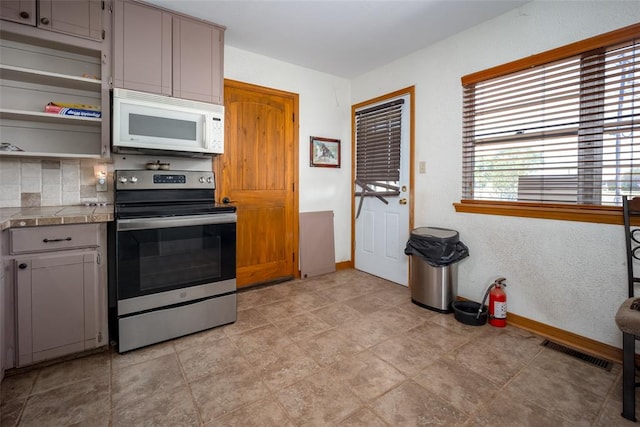 kitchen featuring gray cabinets, electric range, and decorative backsplash