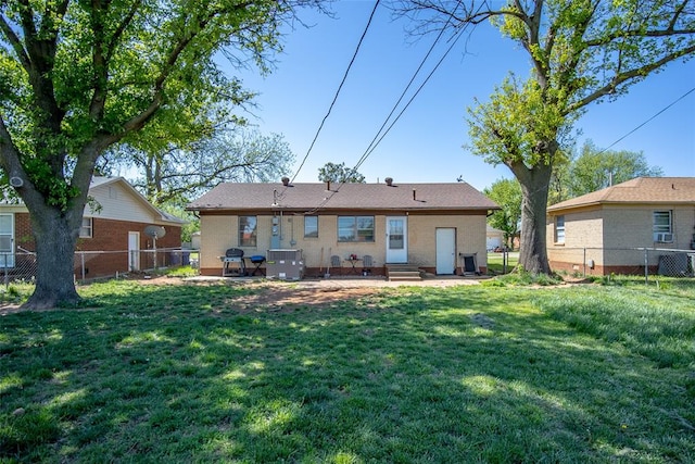 rear view of property featuring a patio area, a yard, and central air condition unit