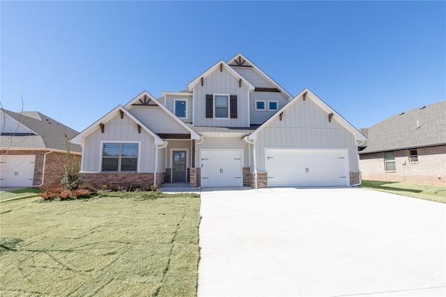 craftsman inspired home featuring board and batten siding, driveway, and a front lawn