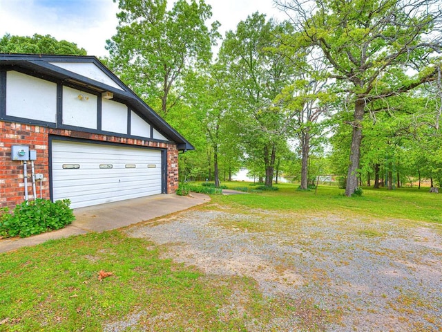 garage featuring a yard