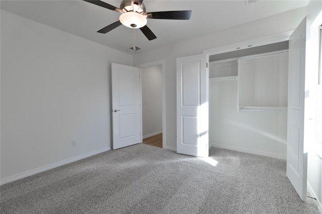 unfurnished bedroom with ceiling fan, a closet, and carpet floors