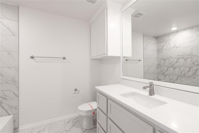 bathroom with vanity and toilet